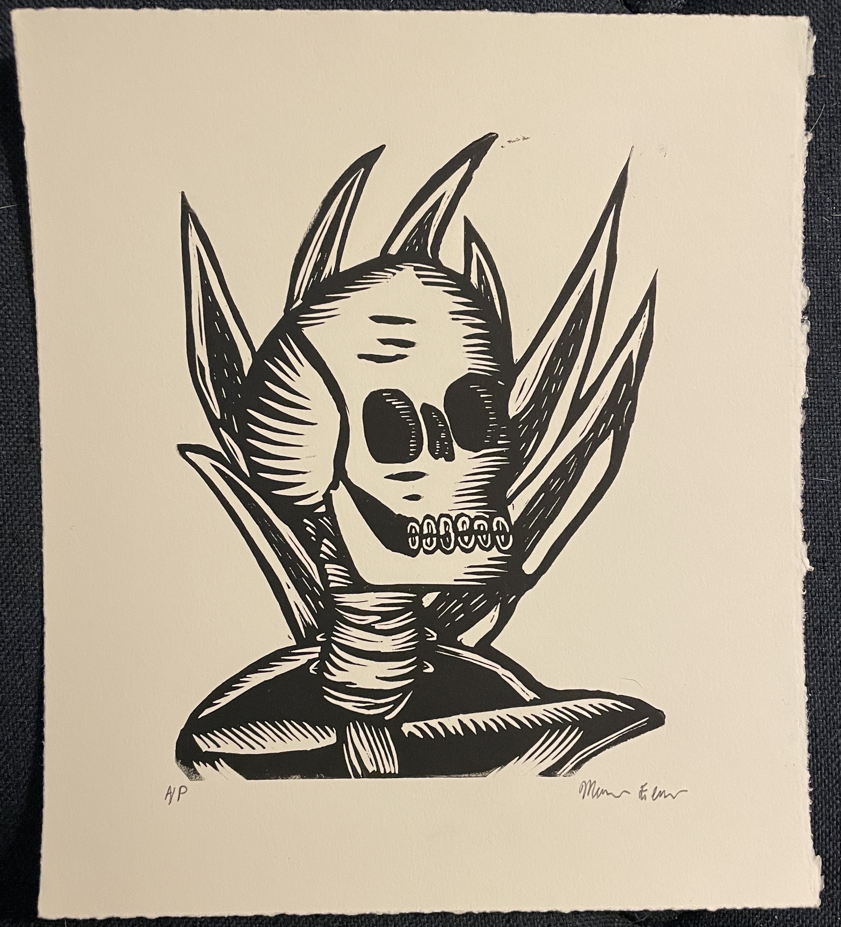 A linocut of a skeleton.